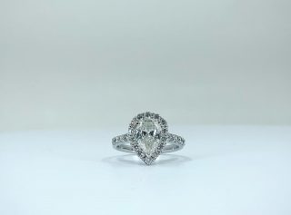 Casting light in every direction, absolutely dreamy. ?Pear-shaped diamond halo, with diamond and 18ct white gold band.